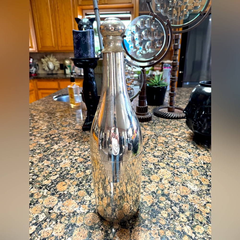 Sleek silver 2000 millennium champagne holder